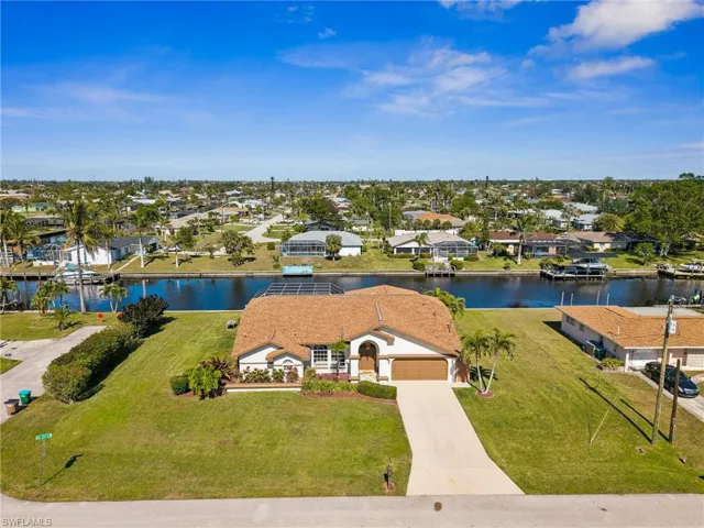 Welcome to 203 SE 37th Lane! Enjoy this oversized corner lot with 165 feet of waterfront!