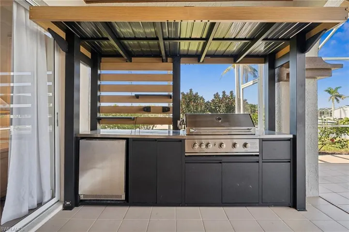 Host guests in style with a custom grilling station and spacious patio.