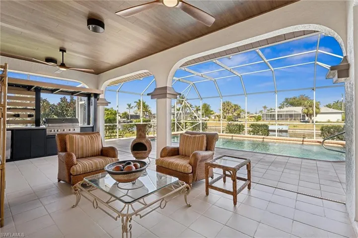 Resort-Style Lanai – Enjoy year-round outdoor living with a covered patio, pool, and canal views.
