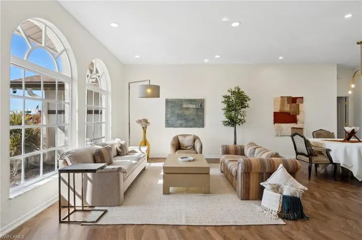 High ceilings, arched windows and natural light create an inviting atmosphere