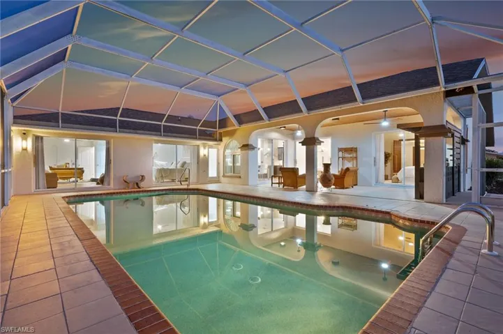 Expansive screened-in lanai with a sparkling pool