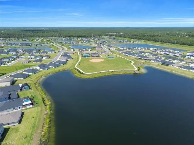 View of property location featuring nearby suburban area and a large body of water