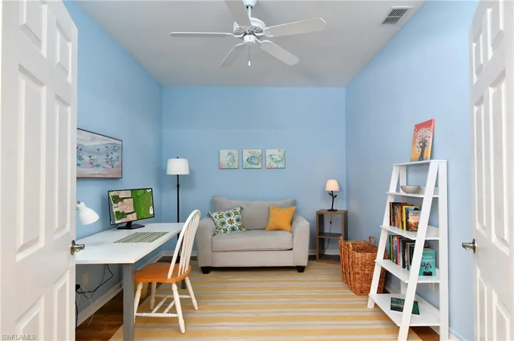 Office space/overflow guest room. Loveseat opens into a sleeper
