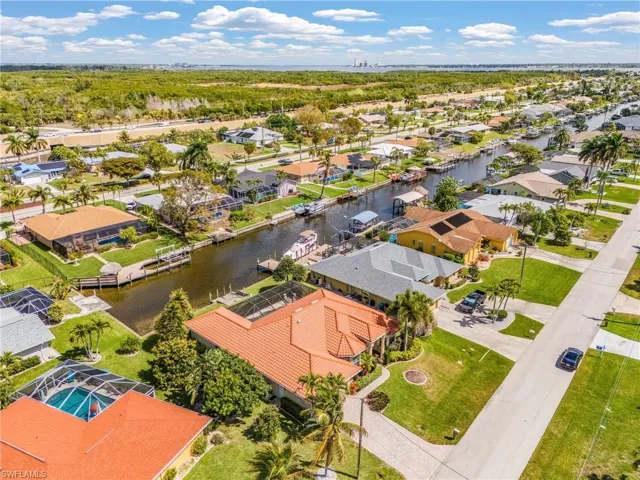 Aerial perspective of suburban area with a nearby body of water