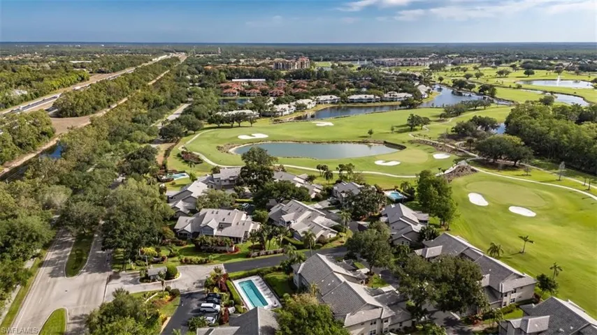 Birds eye view of property with a water view, golf course view, and a residential view