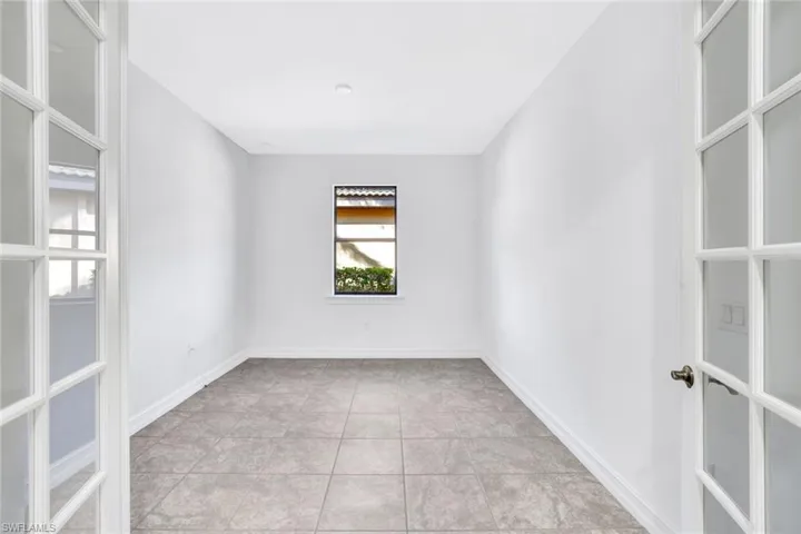 Spare room with light tile patterned floors
