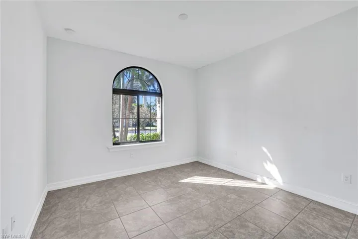 Unfurnished room featuring light tile patterned floors