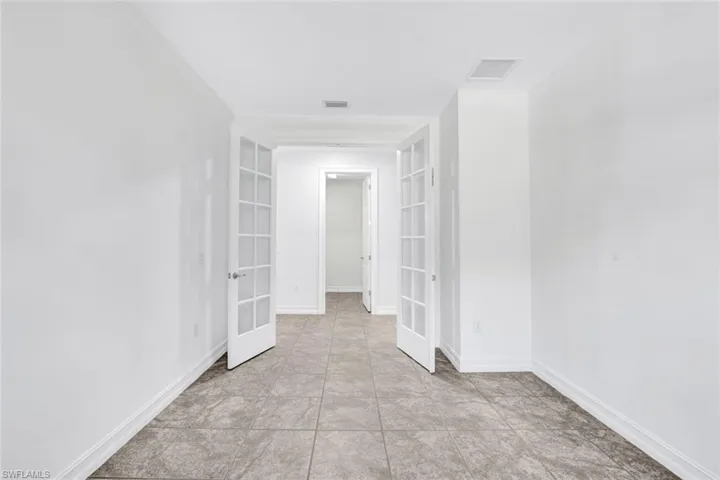 Spare room with french doors