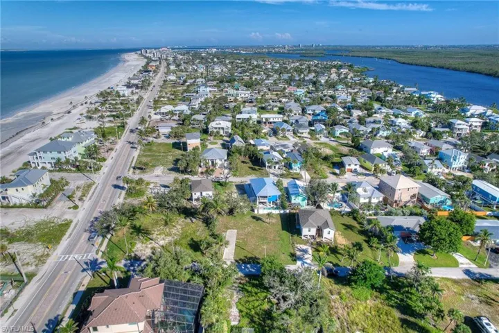 Aerial overview of property's location featuring a large body of water and property boundaries highlighted