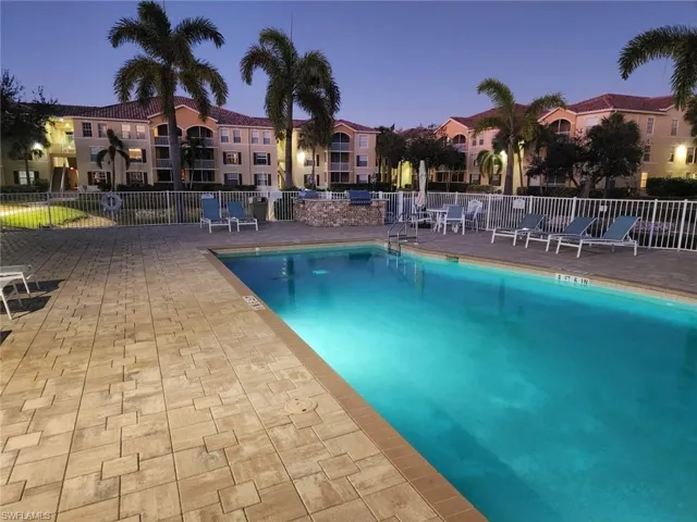 Community pool with a patio area