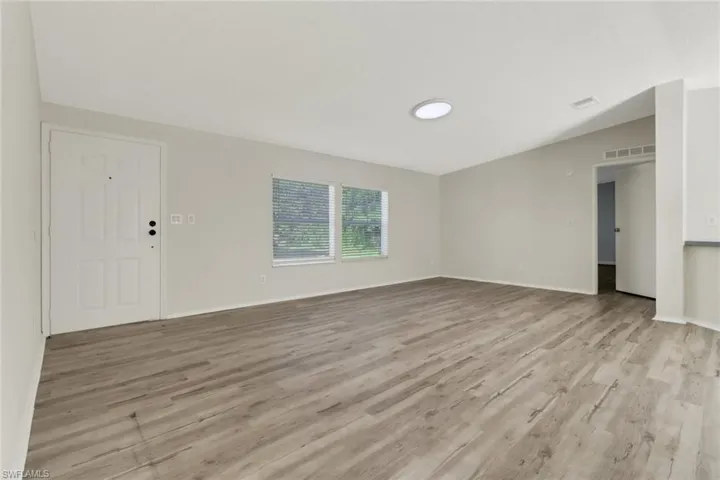 Unfurnished room featuring light wood-type flooring