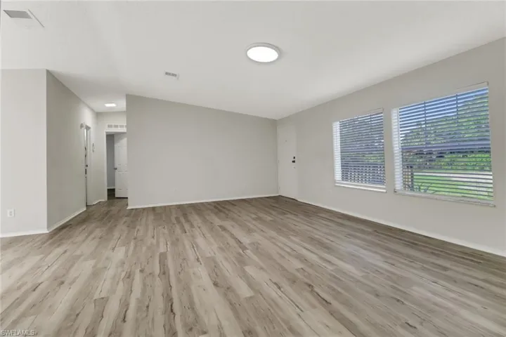 Empty room featuring light wood-type flooring
