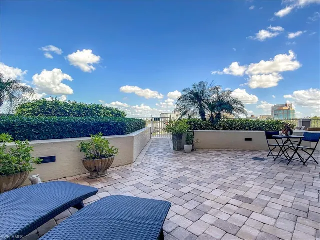 View of patio / terrace with outdoor dining area and a gate