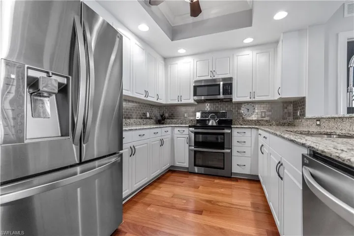 Kitchen featuring double ovens, French door refrigerator and plenty of cabinets and counter space