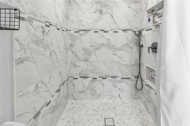 Bathroom with curtained shower