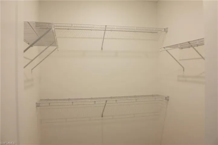 MasterBedroom Closet White wire shelving system