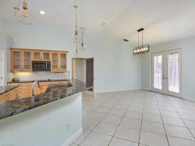 Ample cabinetry, breakfast bar, and casual dining nook.