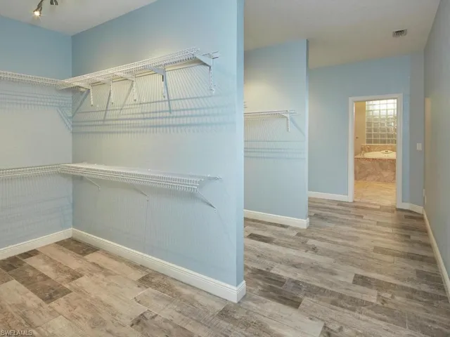 HUGE closet shelving and stylish flooring.