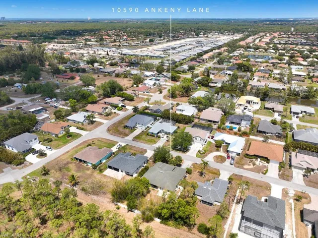 Expansive aerial view looking toward the Gulf, emphasizing the unbeatable Bonita Springs location.