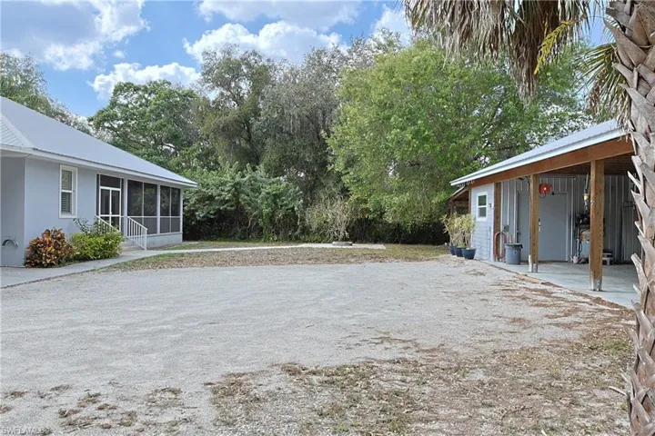 View of yard with a sunroom