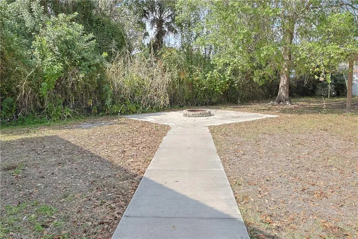 View of yard with a fire pit
