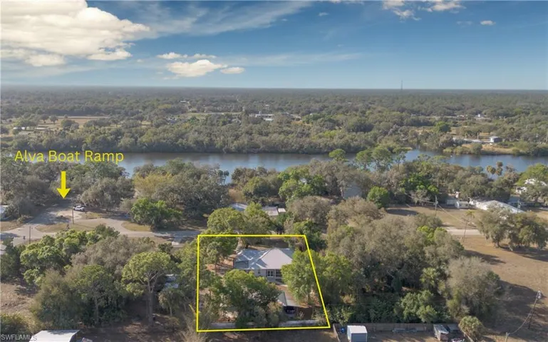 View of property location featuring property boundaries highlighted and a nearby body of water