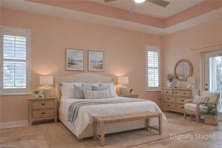 Bedroom featuring multiple windows and a ceiling fan