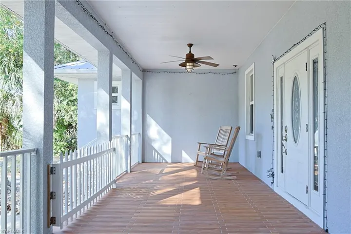 Deck with ceiling fan and a sunroom