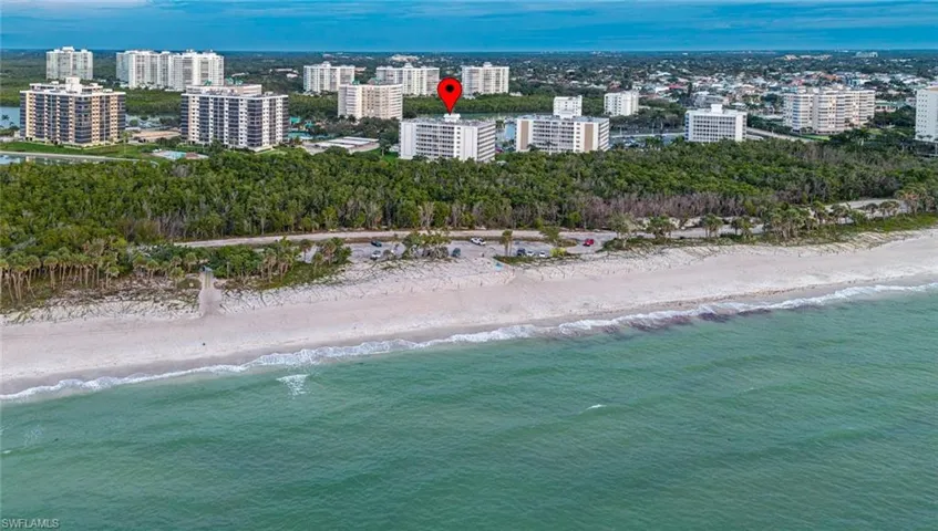 Building just on other side of beach behind mangroves