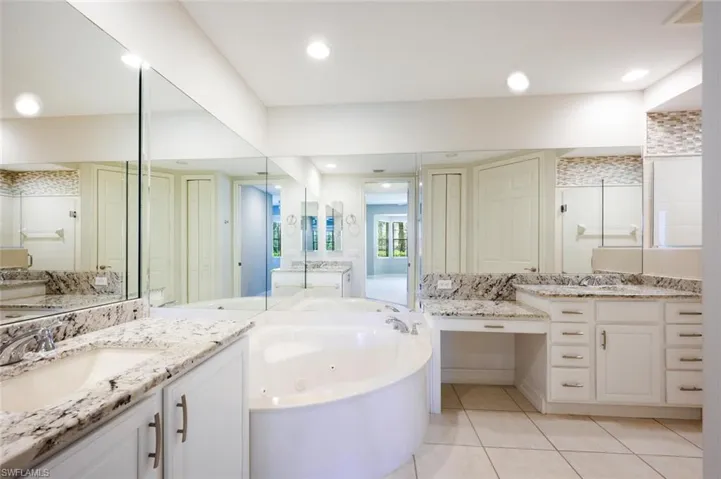 Mather Bathroom featuring Custom Mirrors,and  Dual Sink w/Granite Counter Tops