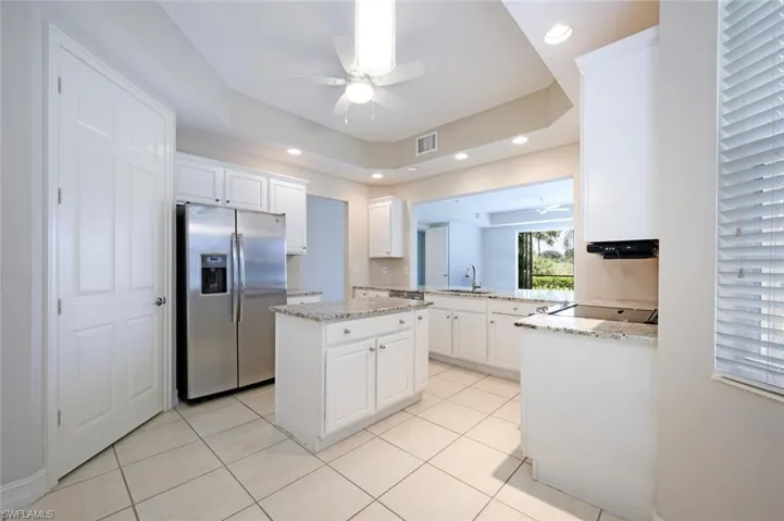 Kitchen with white cabinetry,Large  Walk-in Pantry and Island with Cabinet Storage