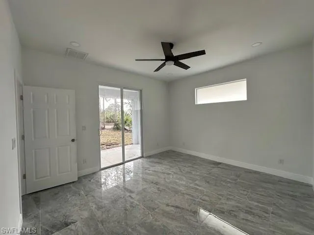Unfurnished room featuring ceiling fan
