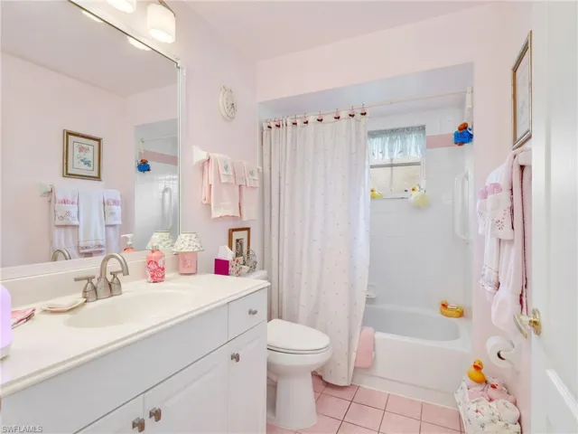 2nd Bathroom featuring a white vanity with integrated sink, brushed nickel faucet, and a large wall-mounted mirror