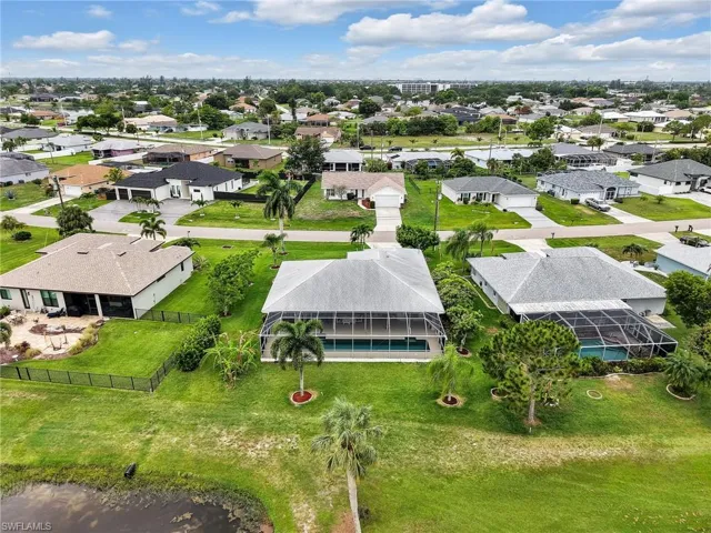 Aerial perspective showcasing a residential street with multiple single-story homes