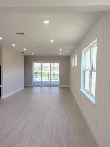 Photo is from a similar Flagstone model. Options for this home may vary. Open concept cafe and gathering room.