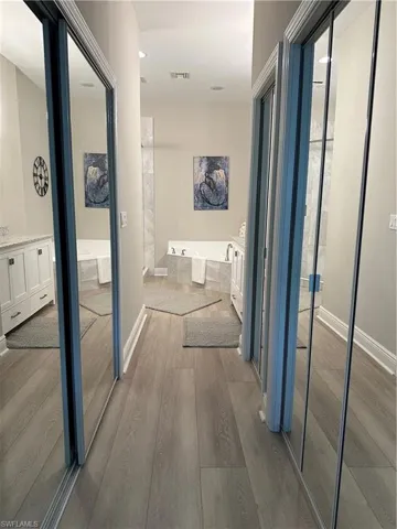 Hall to bath from primary bedroom