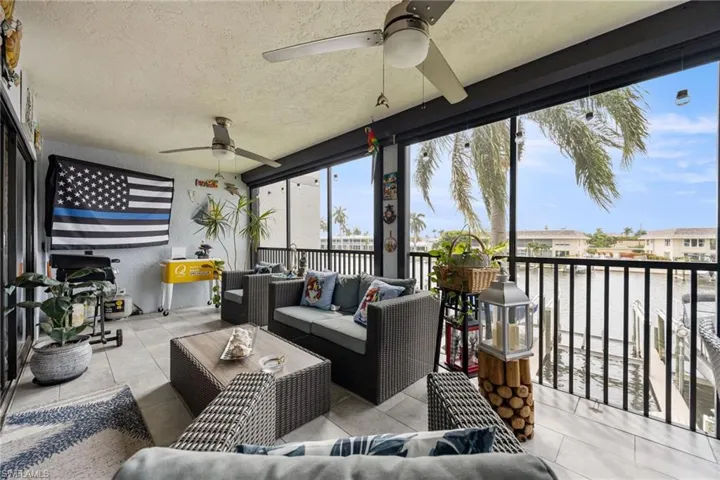 Screened outdoor living area with water frontage