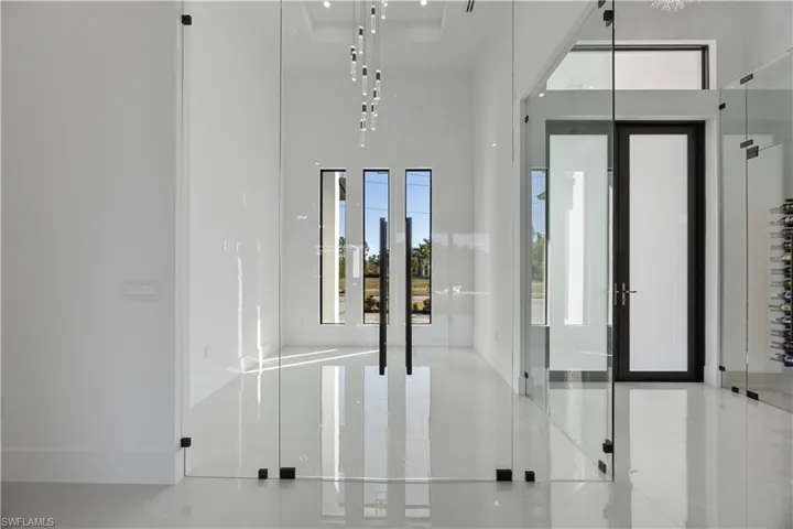 Foyer entrance featuring a high ceiling