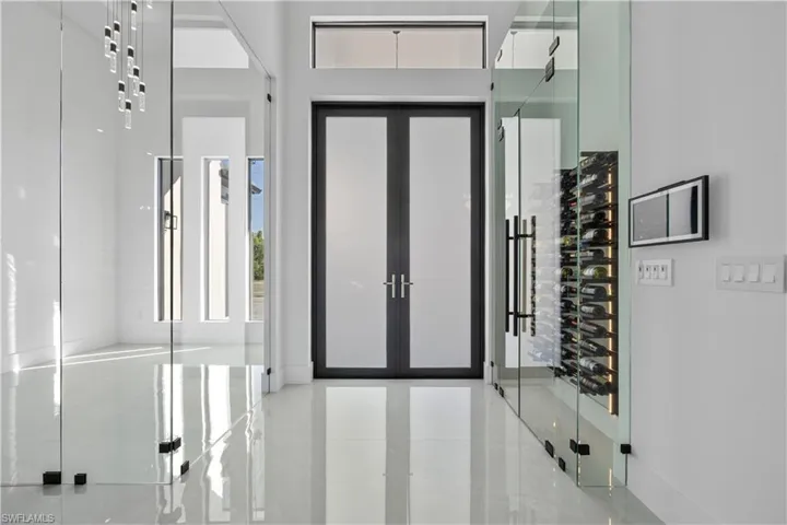 Entrance foyer featuring tile patterned flooring and french doors
