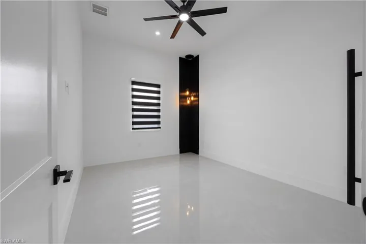 Unfurnished room with a ceiling fan and recessed lighting