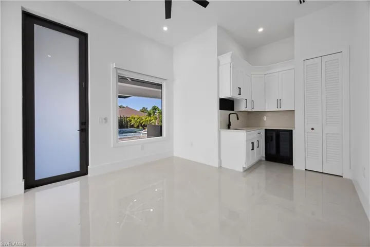 Mother In Law Living room with white cabinets, wine cooler, recessed lighting, and a ceiling fan