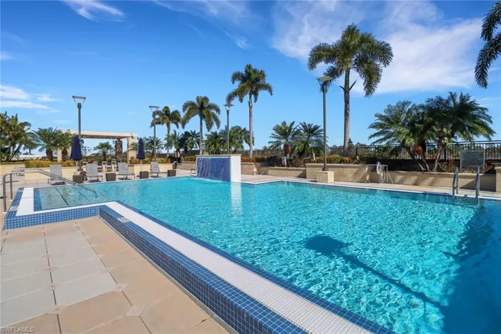 Community pool featuring a patio