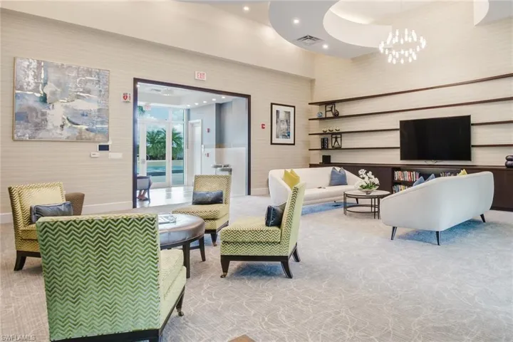 Lobby featuring wallpapered walls, recessed lighting, and a high ceiling