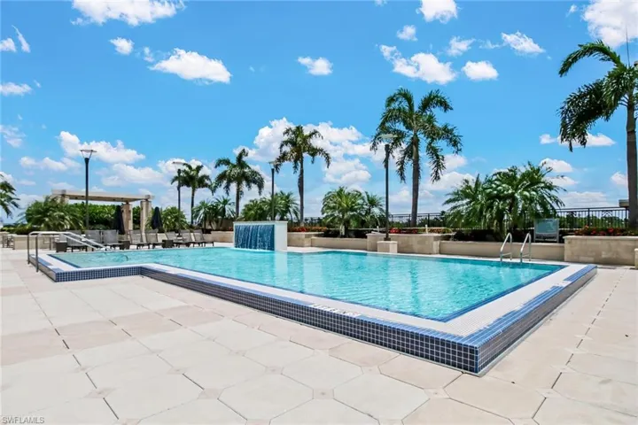 Community pool with a patio