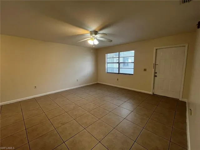 Large open living area is bright with natural light, the large tile runs throughout the home.