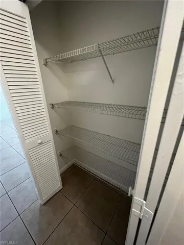 Hall Pantry/Linen closet is located near the kitchen and across from the interior laundry room.