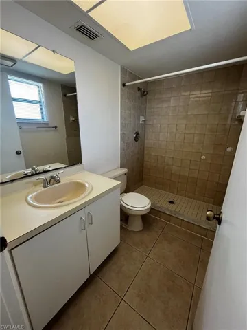 Master bath features tiled walk-in tiled shower