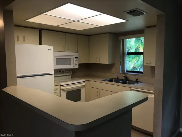 Cozy, well-lit kitchen features great additional counter space or  as a  breakfast bar.