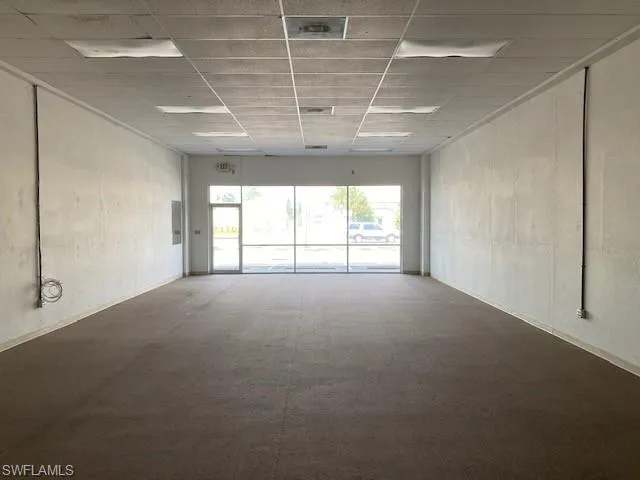 Unfurnished room with a paneled ceiling