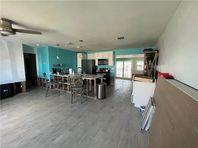 View of Great Room and Kitchen from front door.